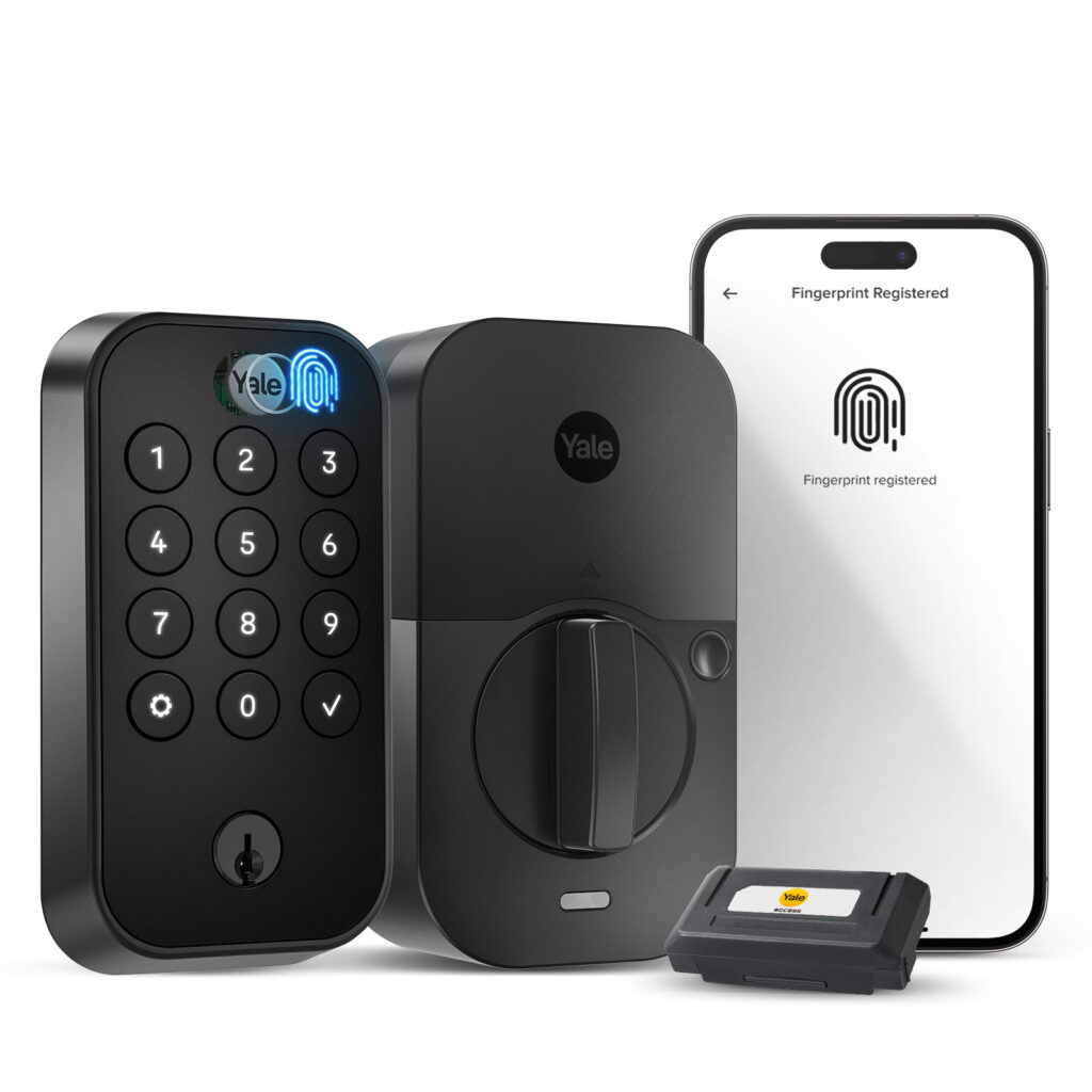Yale Smart Keypad Locks set with keypad, deadbolt, key module, and smartphone displaying Fingerprint Registered screen. All devices are black and arranged side by side.